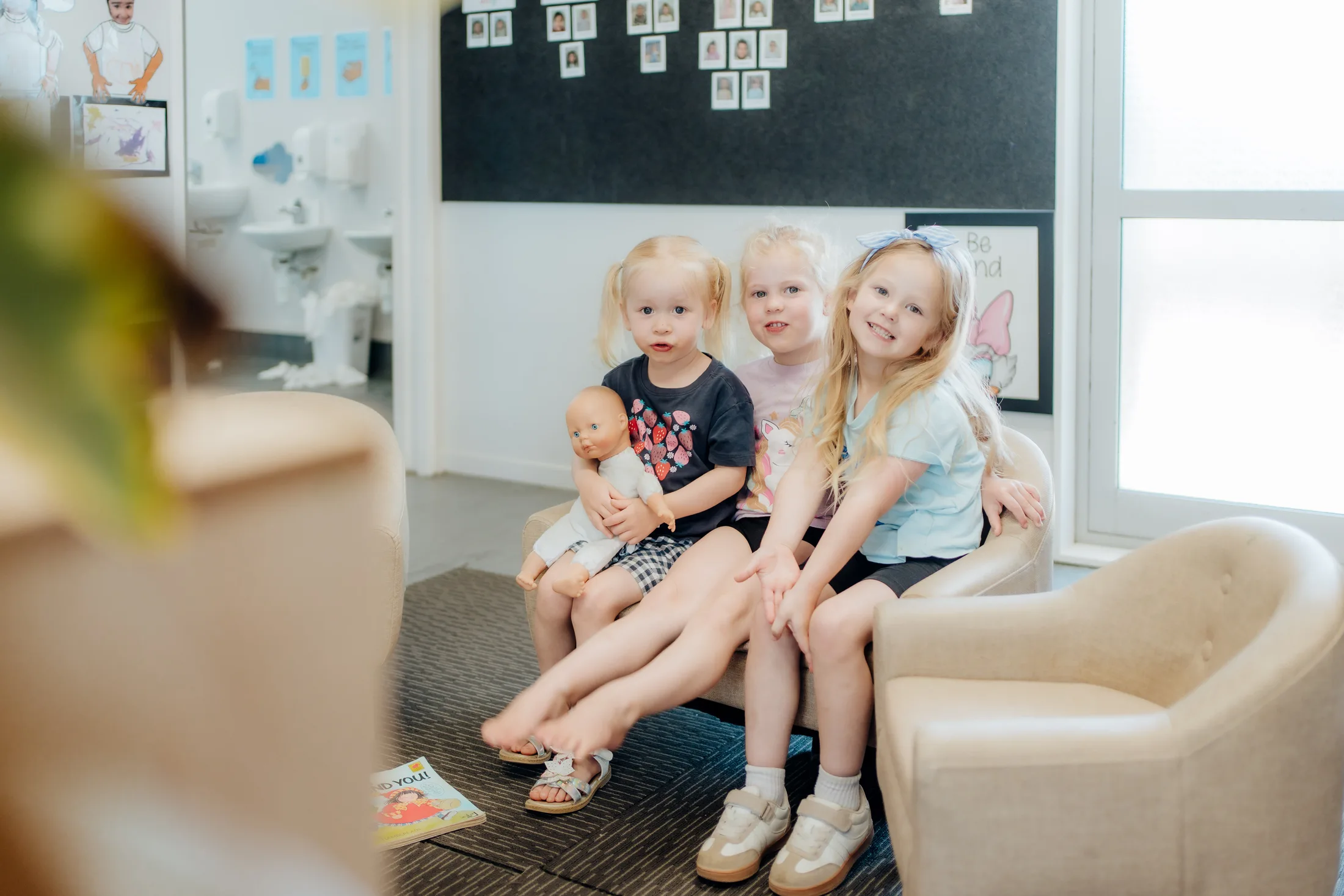 Three Tiny Legends children relaxing together