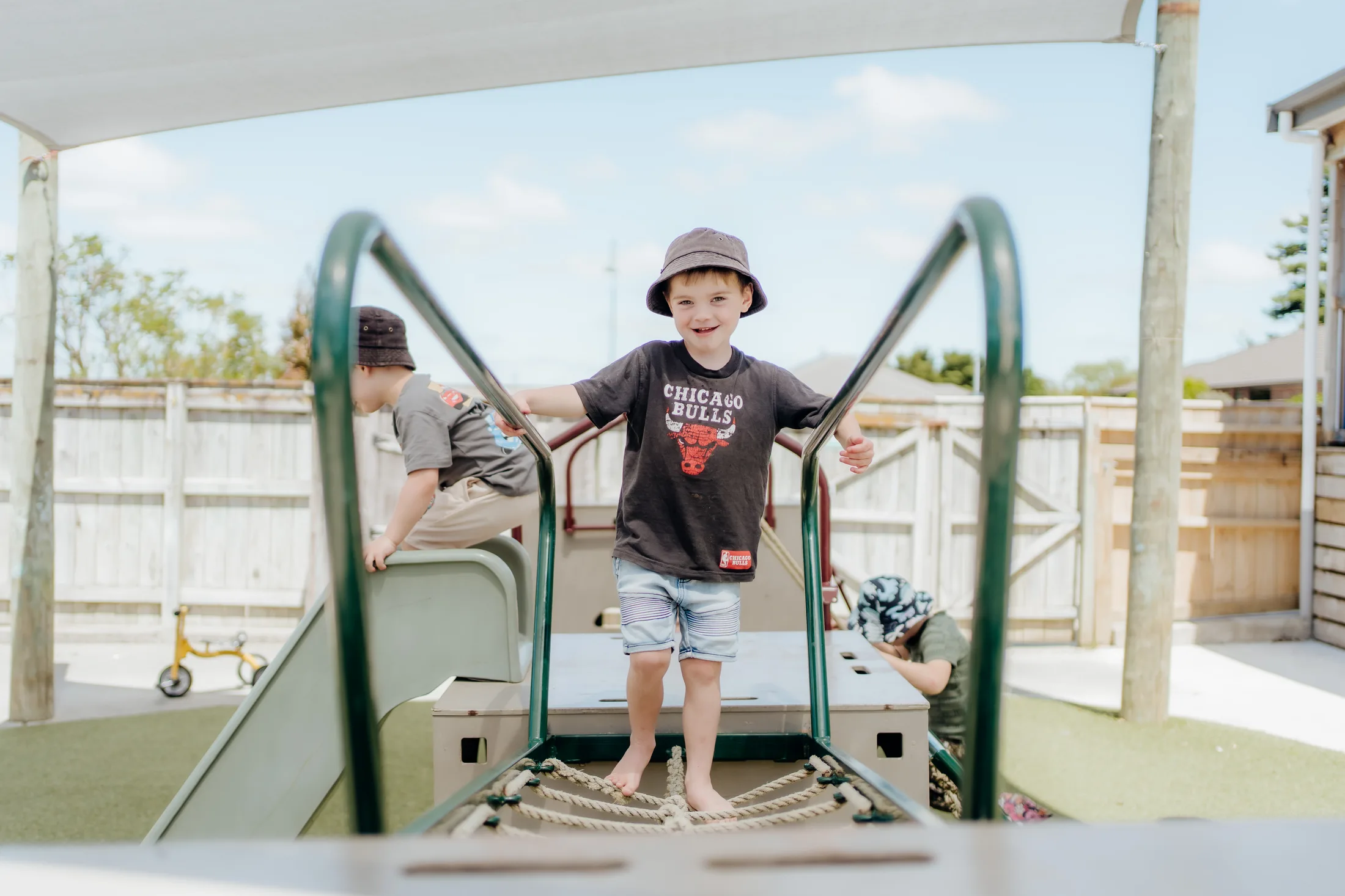 Two children exploring the outdoor playground