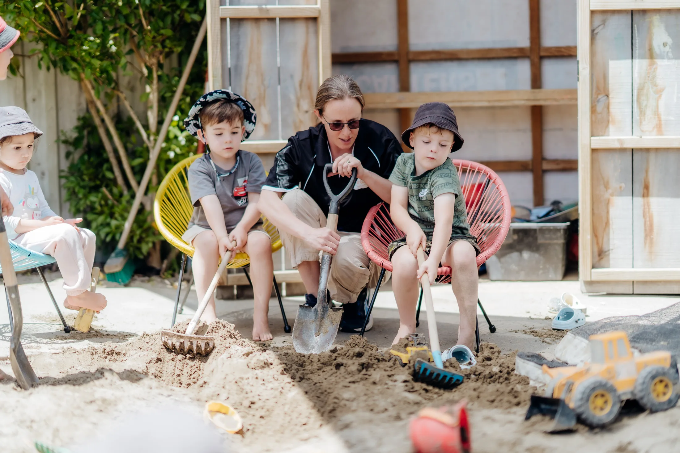 Children collaborating in the sandpit