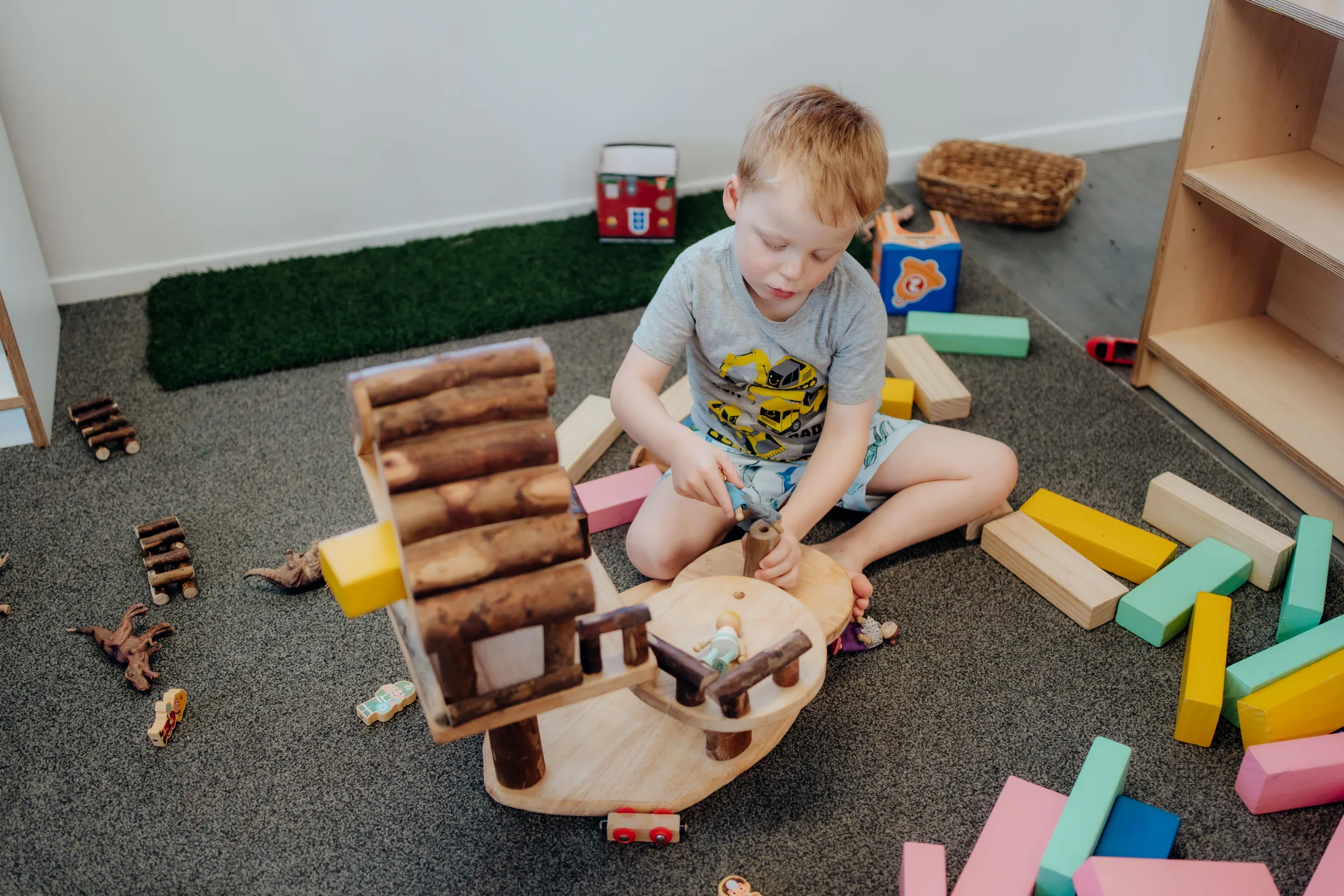 A child building with wooden blocks