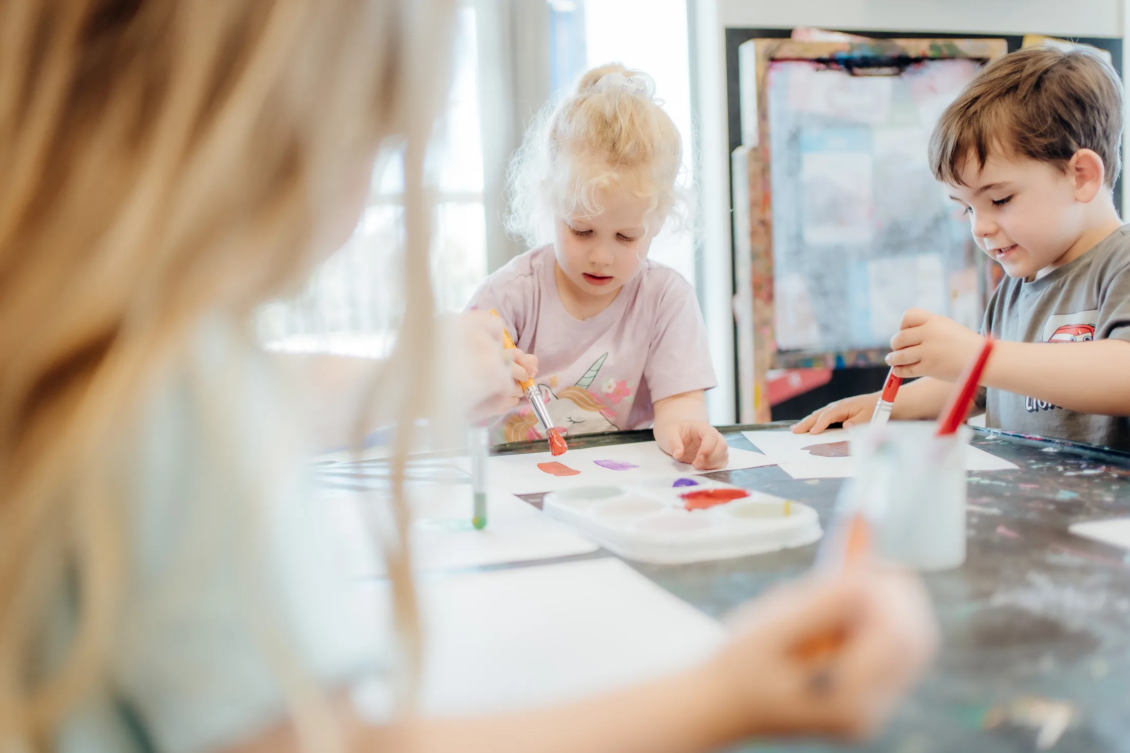 Children creating art together