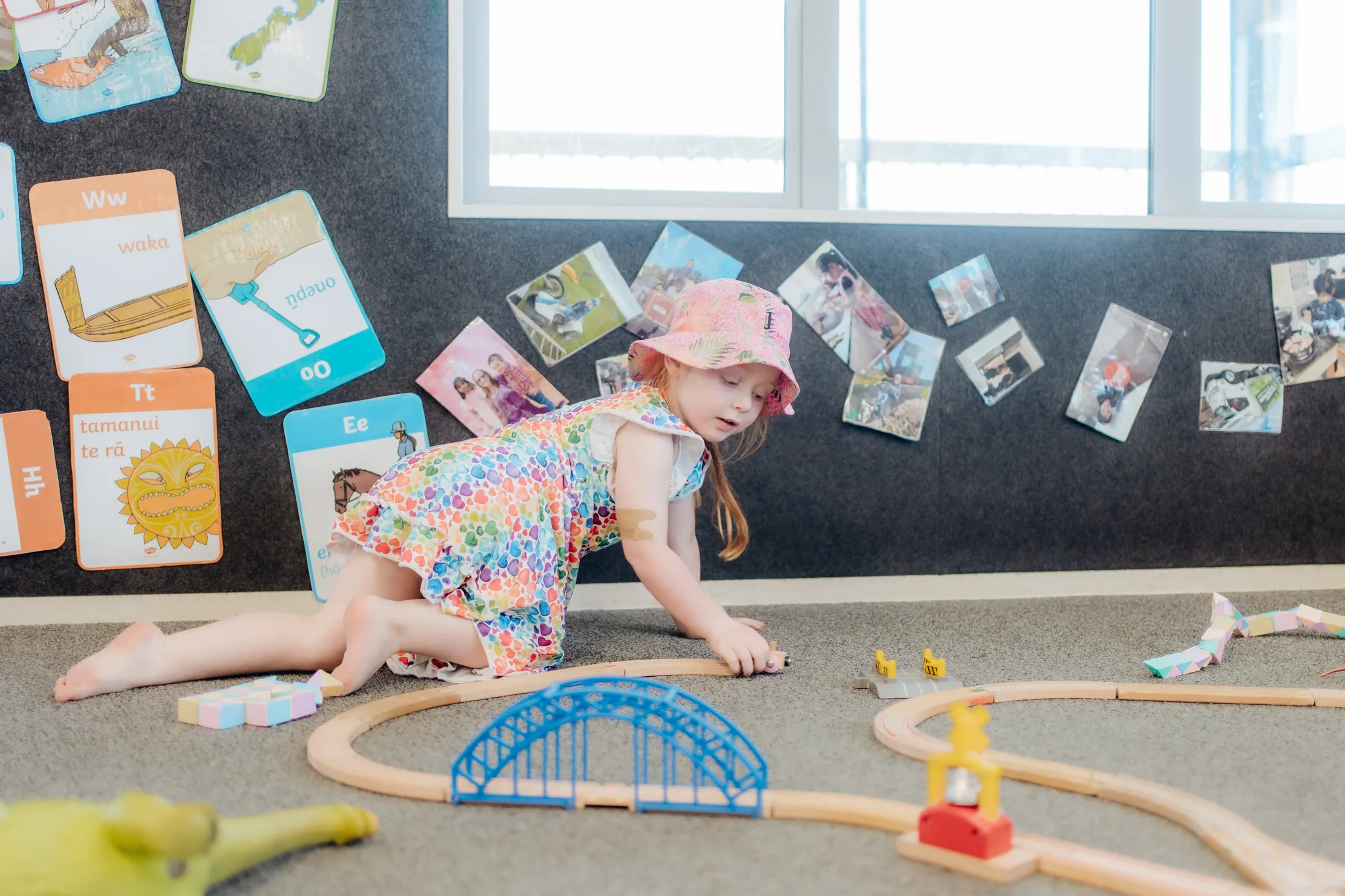 A Mighty Legends child exploring a play-based learning activity